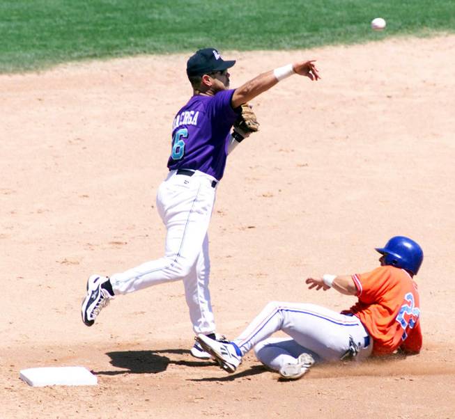 Vancouver's Jeff Ball is out at second base as Las Vegas second baseman Carlos Baerga turns a double play at Cashman Field Sunday, June 6, 1999. ETHAN MILLER / LAS VEGAS SUN --